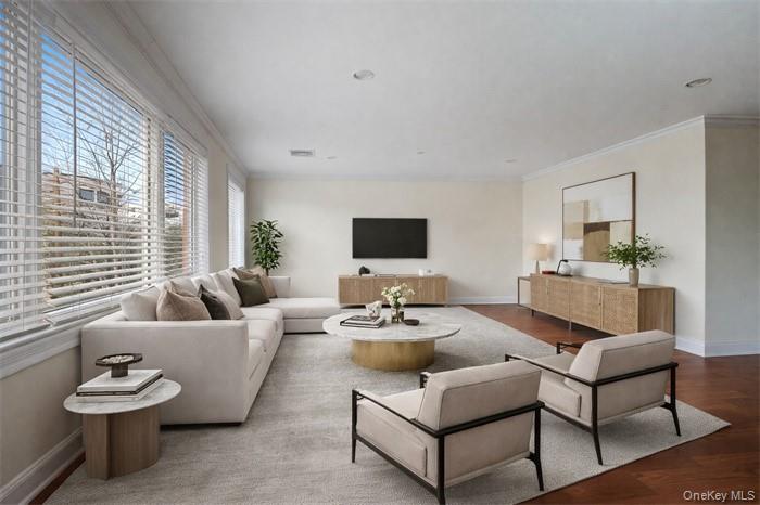 171 Great Neck Road, Unit 1C Great Neck, NY 11021 - Photo 3 of 17 a living room with furniture and a large window