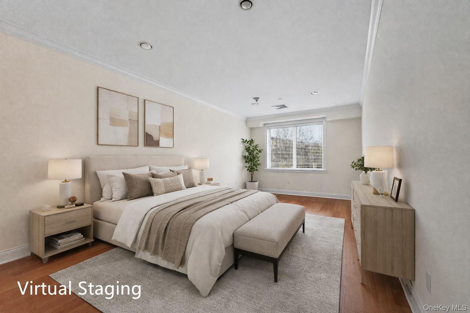 171 Great Neck Road, Unit 1C Great Neck, NY 11021 - Photo 9 of 17 a bedroom with a bed and window