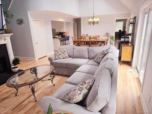 a dining room with furniture and wooden floor