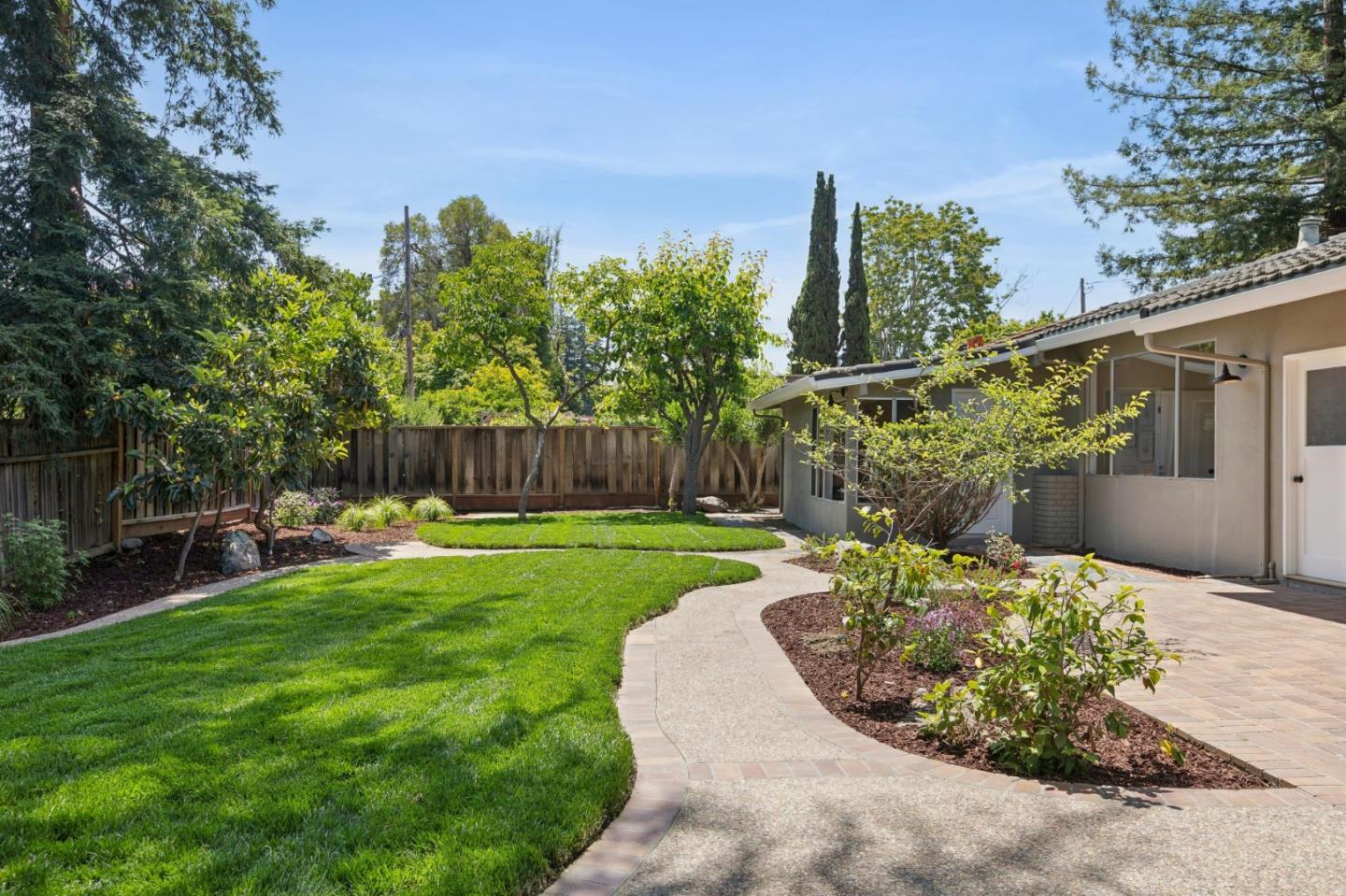 755 Santa Rita Avenue Los Altos, CA 94022 - Photo 44 of 50 a view of a chair and table in the garden
