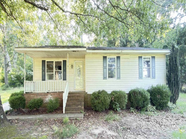 516 Murph Road Pauline, SC 29374 - Photo 1 of 1 A charming single-story residence with a welcoming covered front porch, nestled among mature trees.