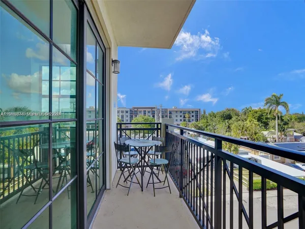 a view of a balcony with furniture
