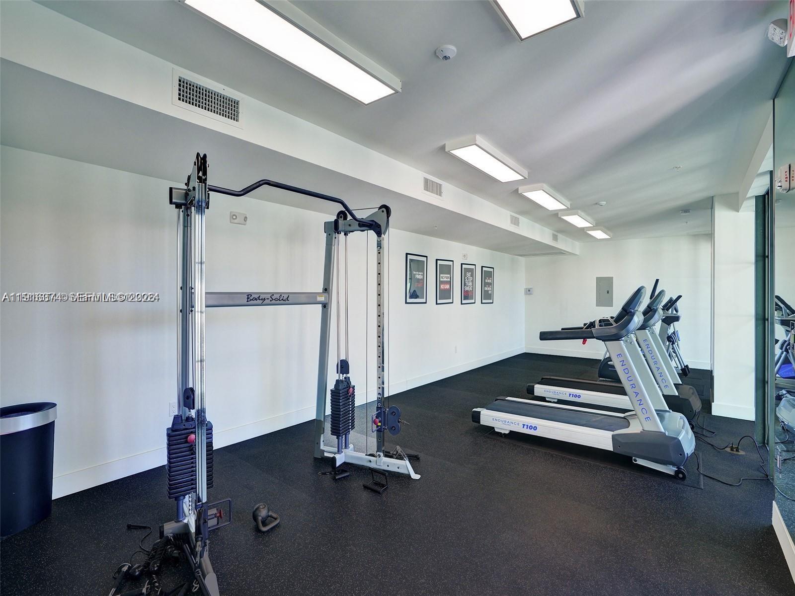 4100 Southwest 64th Avenue, Unit 308 Davie, FL 33314 - Photo 27 of 41 a room with gym equipment and a wooden floor