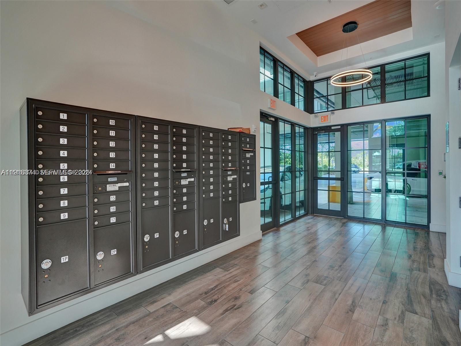 4100 Southwest 64th Avenue, Unit 308 Davie, FL 33314 - Photo 34 of 41 a view of entryway and hall with wooden floor