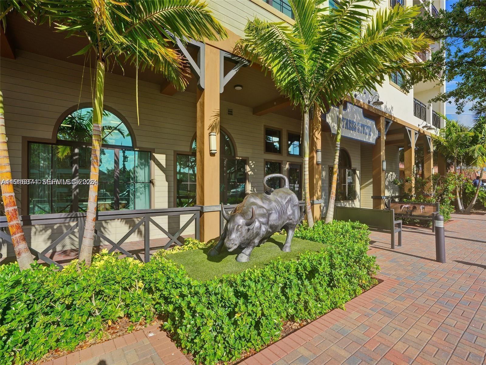 4100 Southwest 64th Avenue, Unit 308 Davie, FL 33314 - Photo 36 of 41 a view of a chairs and table in a backyard