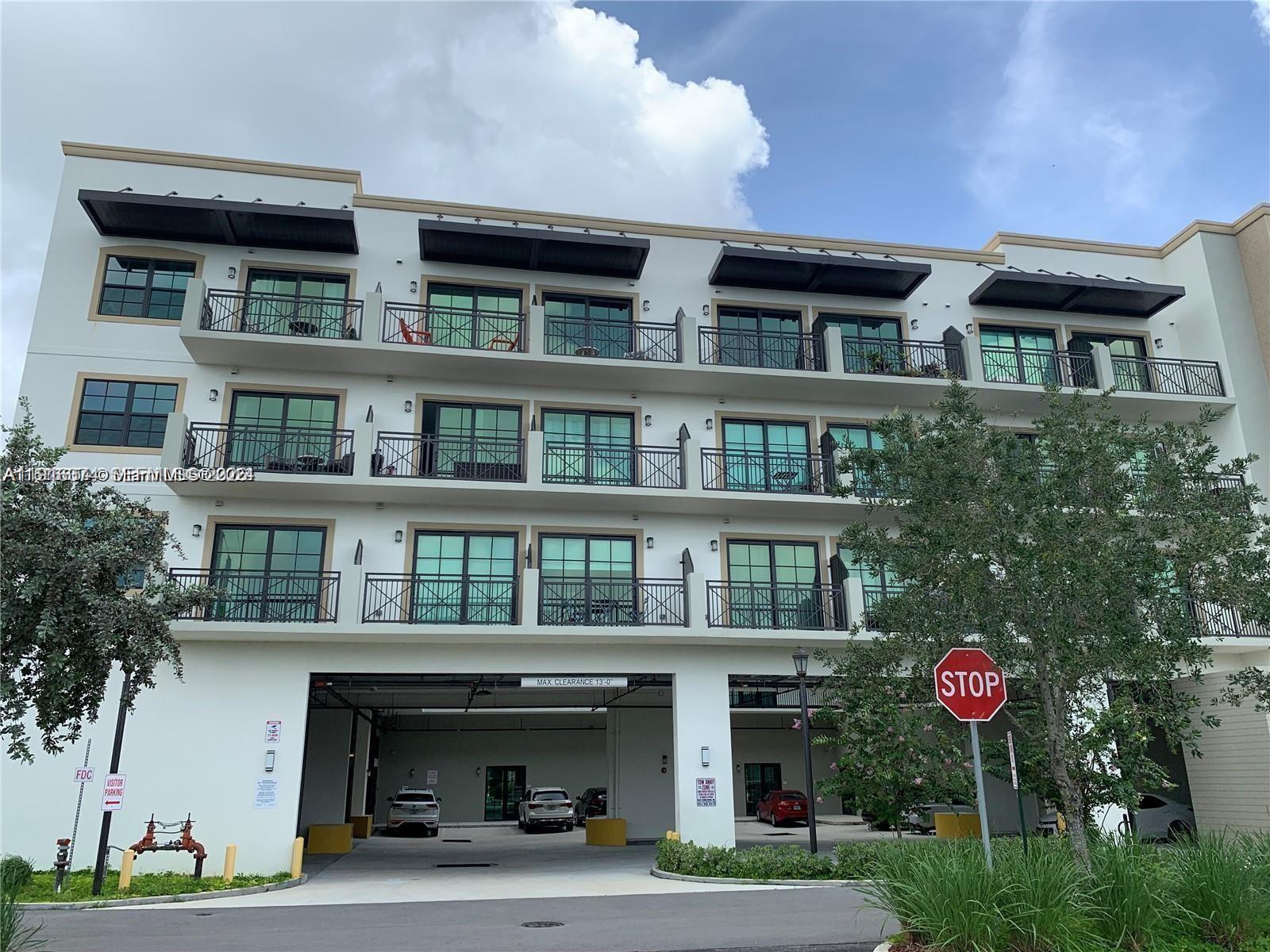 4100 Southwest 64th Avenue, Unit 308 Davie, FL 33314 - Photo 4 of 41 a front view of a multi story building