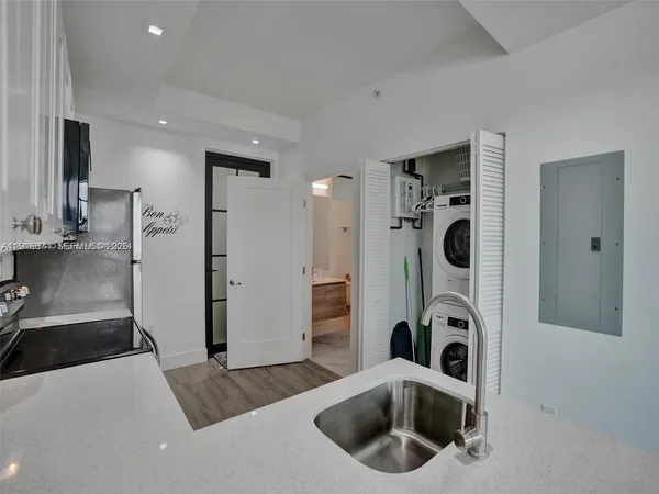a view of a kitchen with washer and dryer