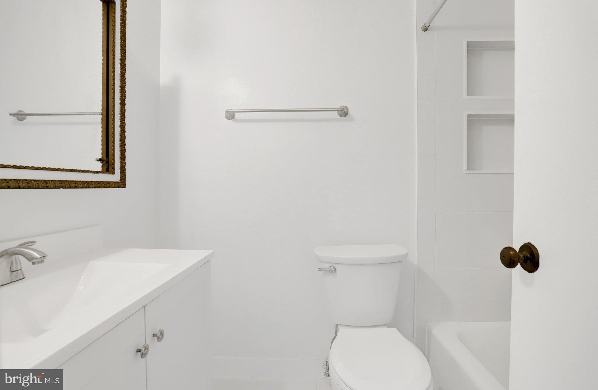 2225 North Tuckahoe Street Arlington, VA 22205 - Photo 16 of 37 a bathroom with a sink a toilet and a mirror