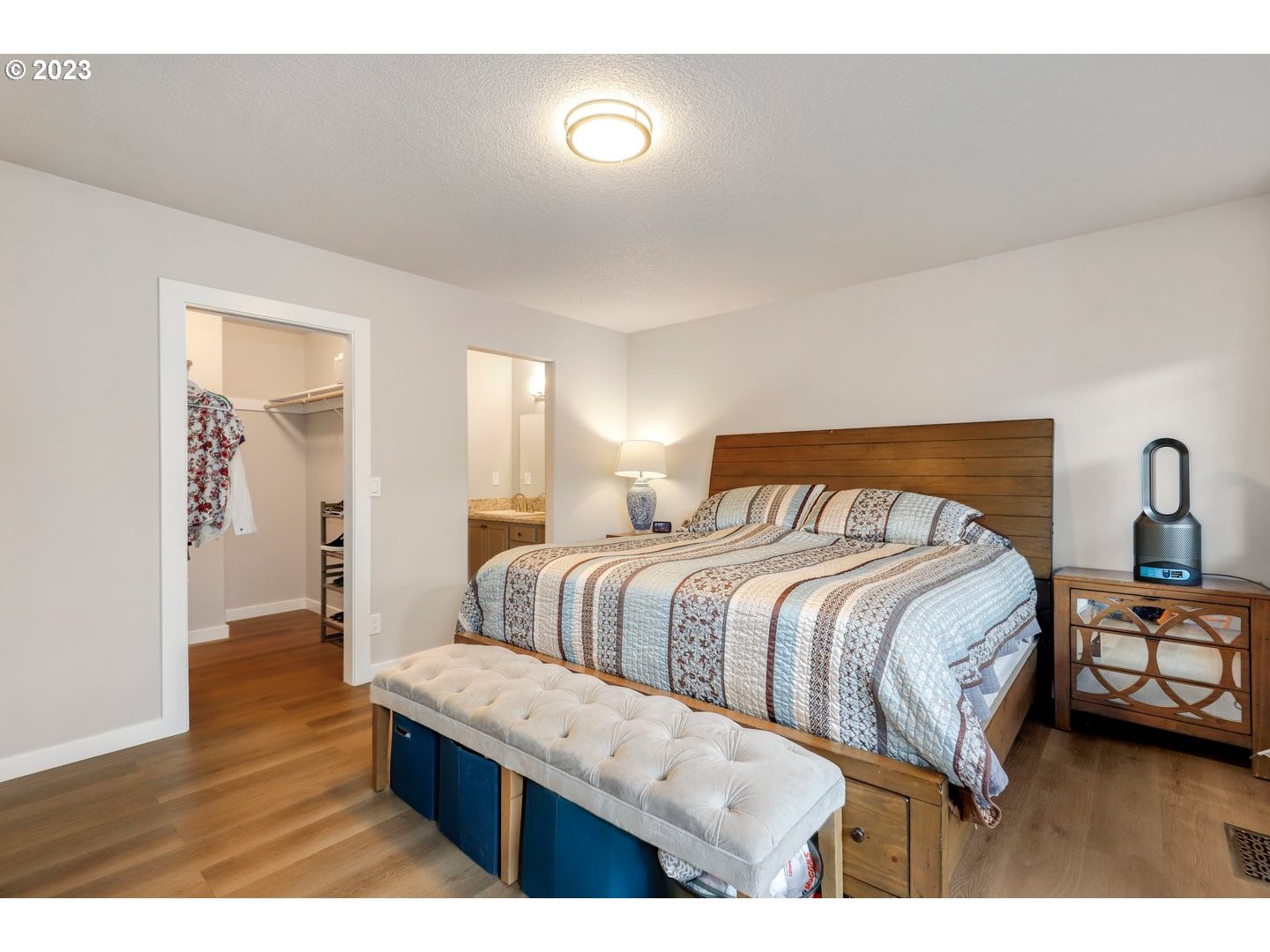 4114 Nicholson Road Vancouver, WA 98661 - Photo 17 of 28 a bedroom with a bed and wooden floor