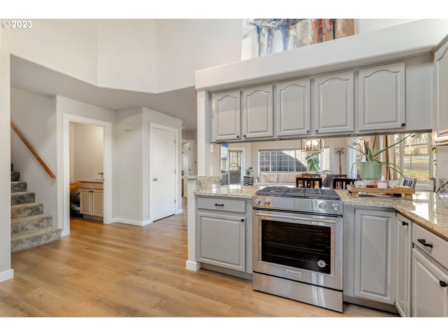 4114 Nicholson Road Vancouver, WA 98661 - Photo 5 of 28 a kitchen with stainless steel appliances granite countertop a stove a sink and a refrigerator