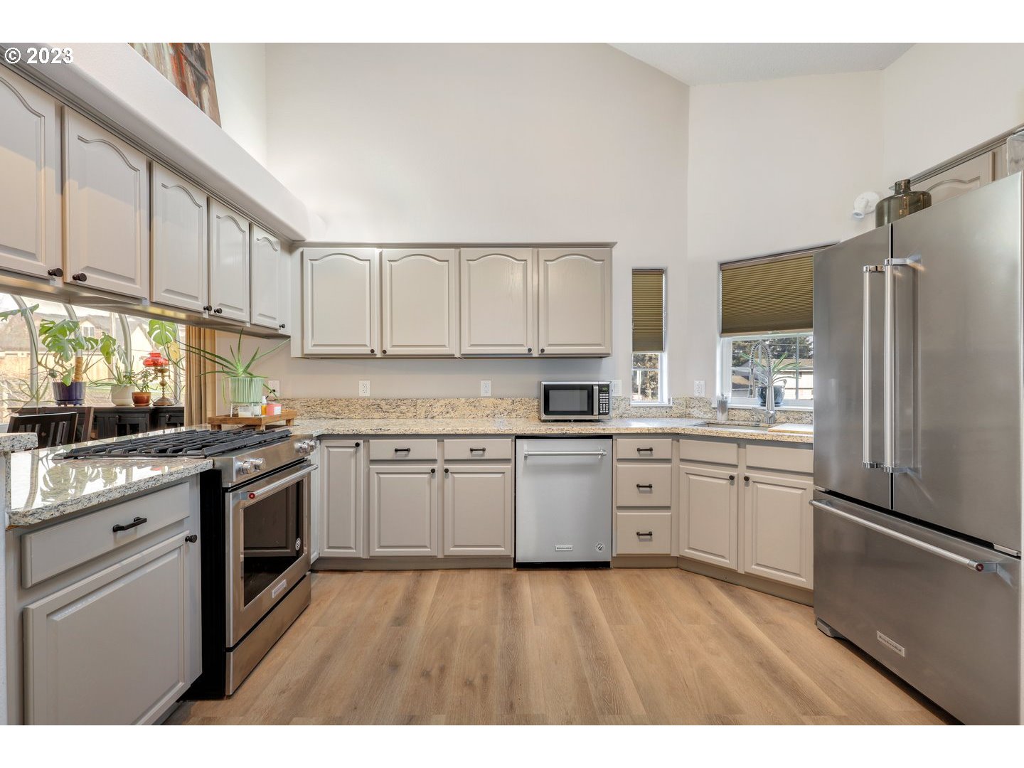 4114 Nicholson Road Vancouver, WA 98661 - Photo 6 of 28 a kitchen with granite countertop stainless steel appliances and wooden cabinets