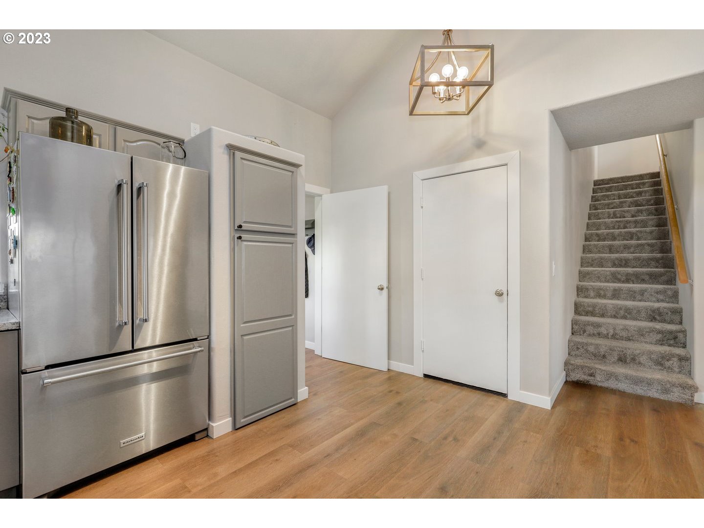 4114 Nicholson Road Vancouver, WA 98661 - Photo 8 of 28 a kitchen with stainless steel appliances wooden floor and a refrigerator