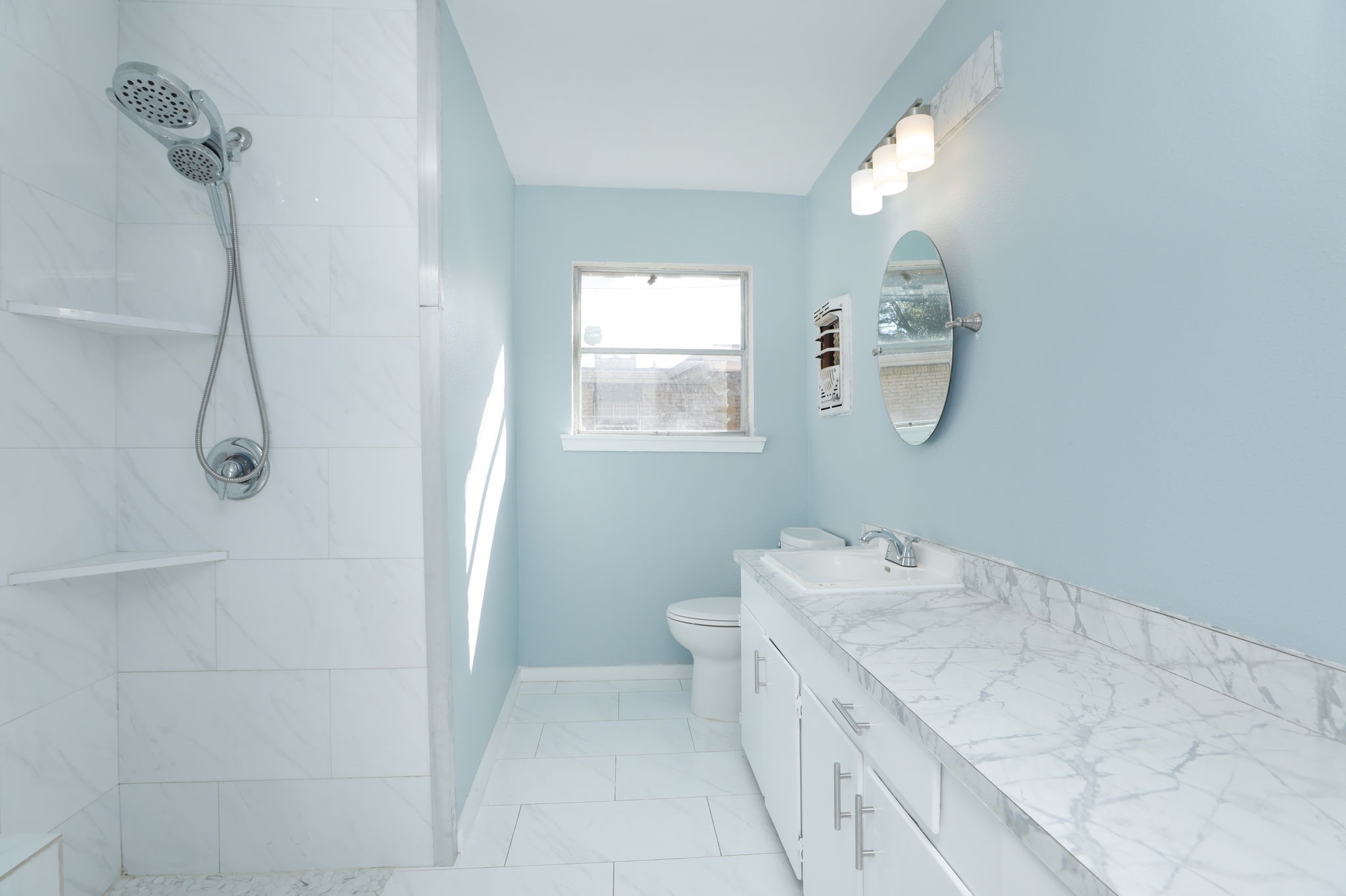 8235 Dover Street Houston, TX 77061 - Photo 22 of 36 a bathroom with a sink vanity and mirror