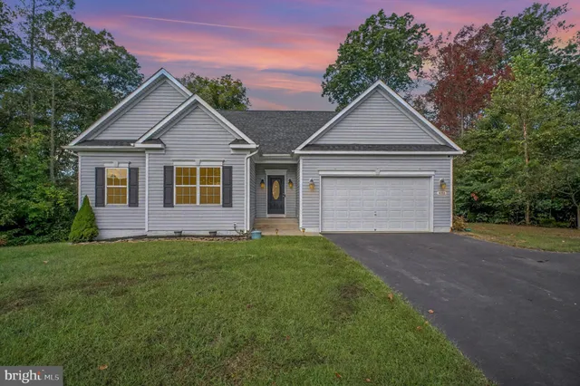 a front view of a house with yard