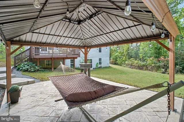 a view of backyard with a garden and outdoor seating