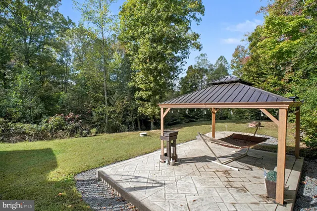 a patio with table and chairs