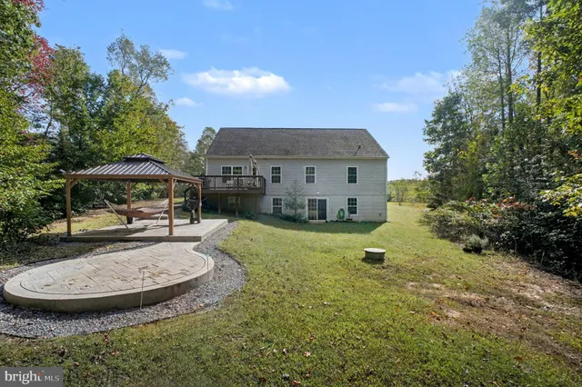 a view of a house with swimming pool and porch