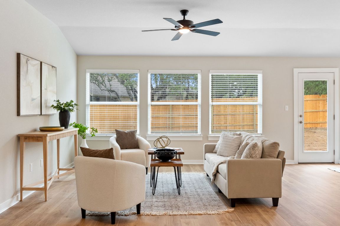 21701 Oregon Lane Leander, TX 78645 - Photo 11 of 31 a living room with furniture and a large window