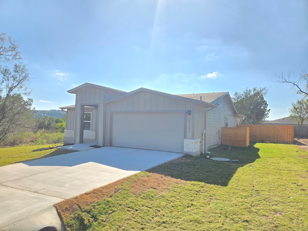 21701 Oregon Lane Leander, TX 78645 - Photo 2 of 31 a house view with a backyard space