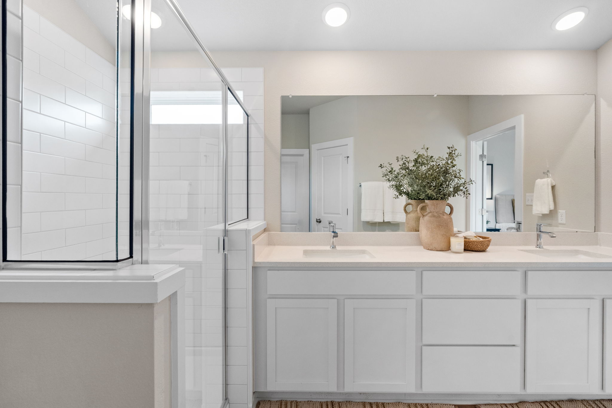 21701 Oregon Lane Leander, TX 78645 - Photo 22 of 31 a bathroom with a double vanity sink and mirror