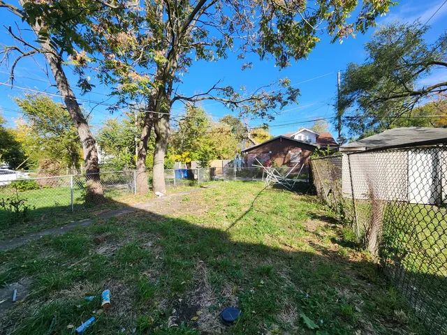 a view of yard with swimming pool