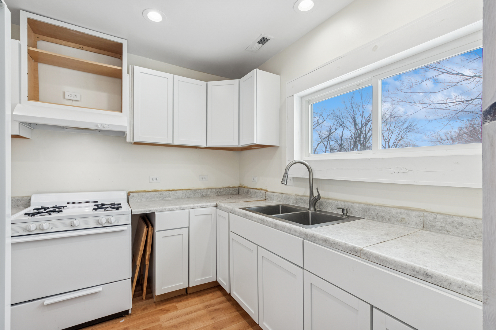 411 East Mazon Street Gardner, IL 60424 - Photo 10 of 21 a kitchen with a sink cabinets and stainless steel appliances