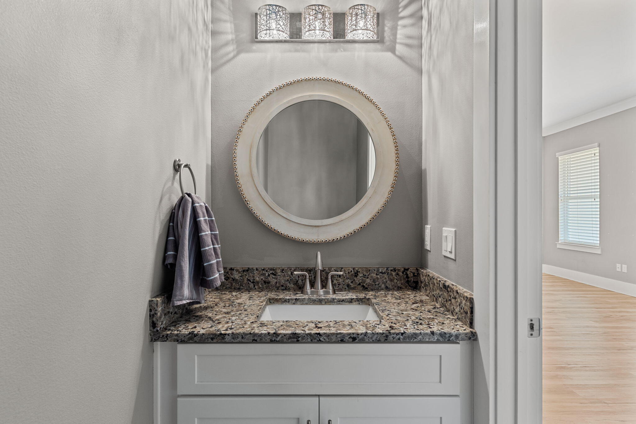 995 Airport Road, Unit 43 Destin, FL 32541 - Photo 12 of 40 a bathroom with a granite countertop sink and a mirror