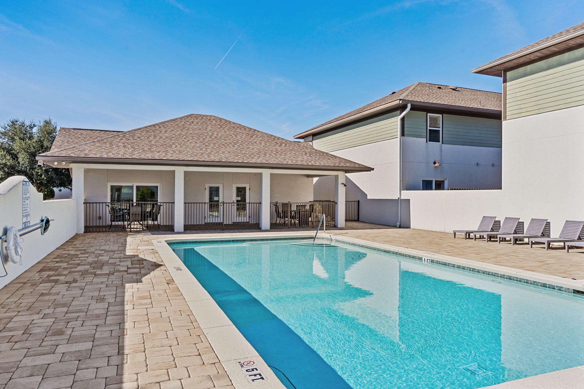 995 Airport Road, Unit 43 Destin, FL 32541 - Photo 36 of 40 a view of a house with swimming pool and sitting area