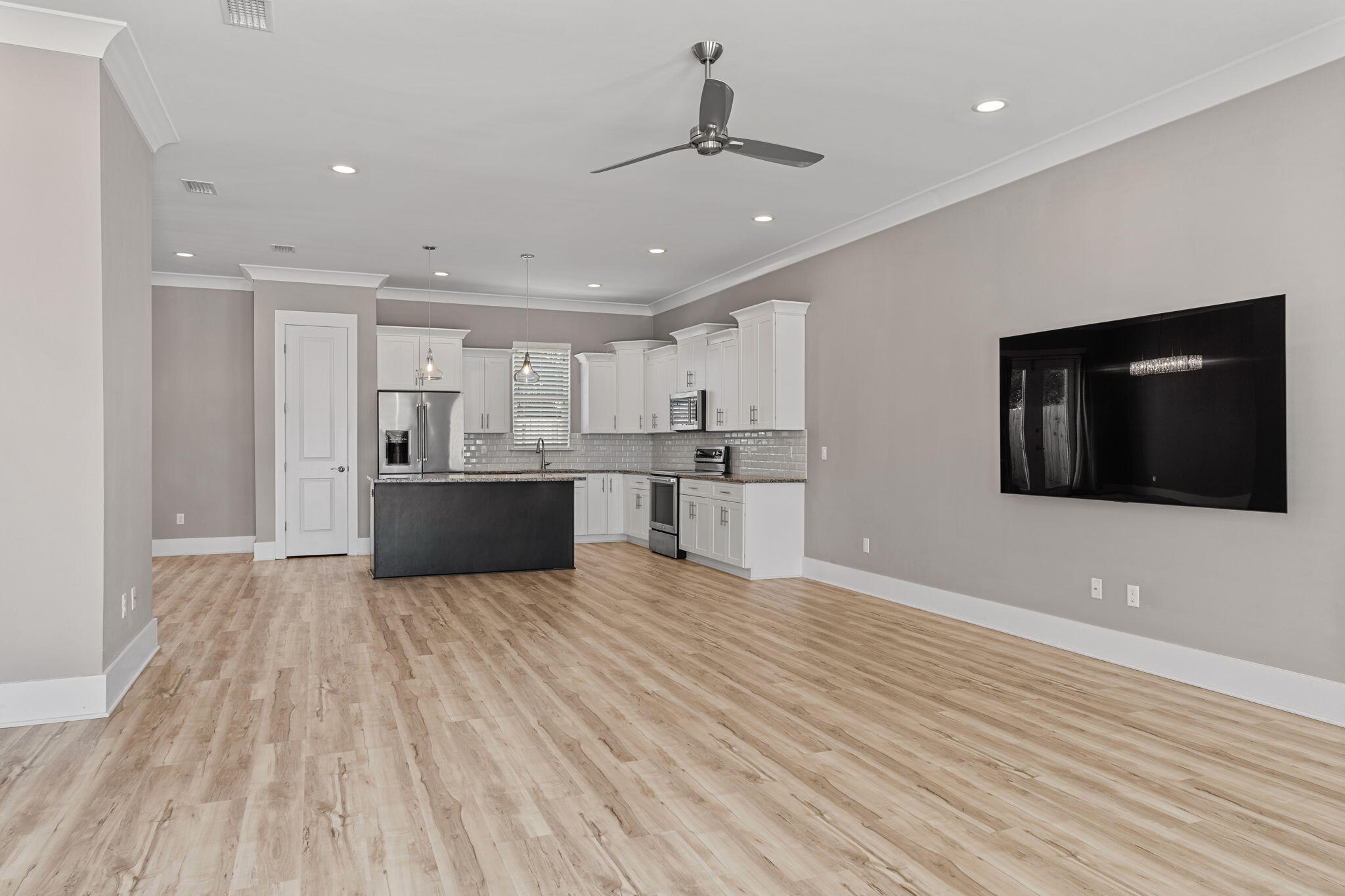 995 Airport Road, Unit 43 Destin, FL 32541 - Photo 4 of 40 a view of kitchen with wooden floor and electronic appliances