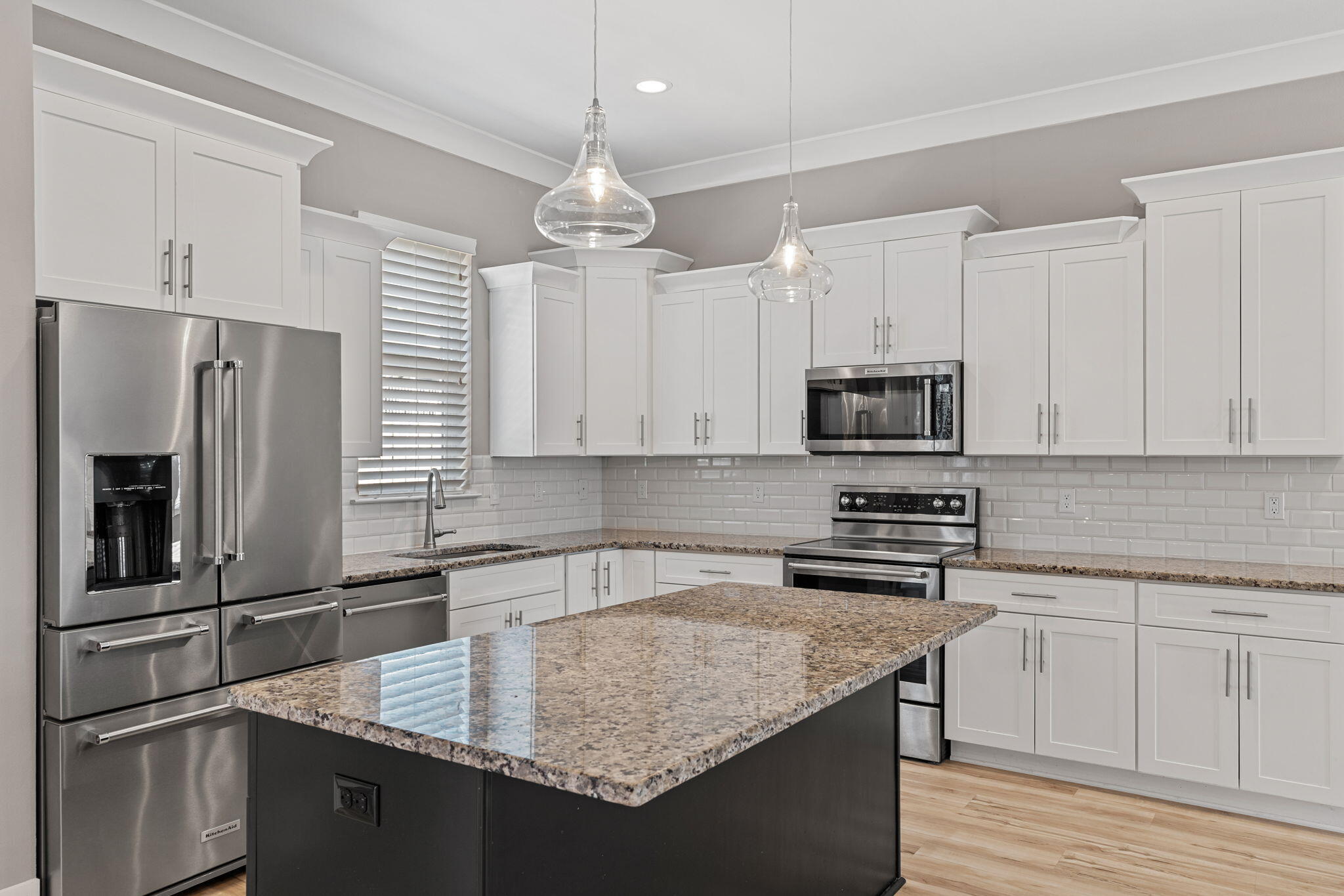 995 Airport Road, Unit 43 Destin, FL 32541 - Photo 5 of 40 a kitchen with stainless steel appliances granite countertop a sink stove and refrigerator