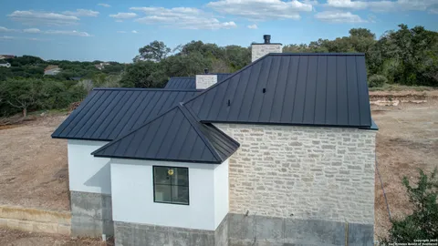a house with wooden fence