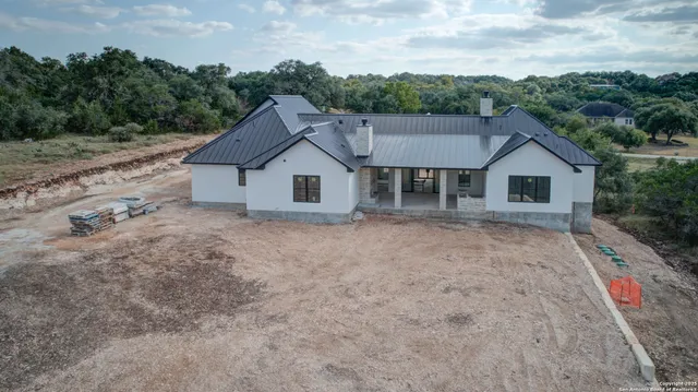 a house with trees in the background