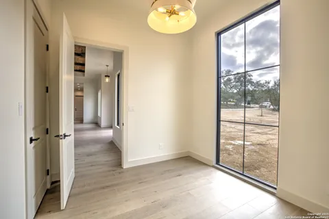wooden floor in an empty room and a window