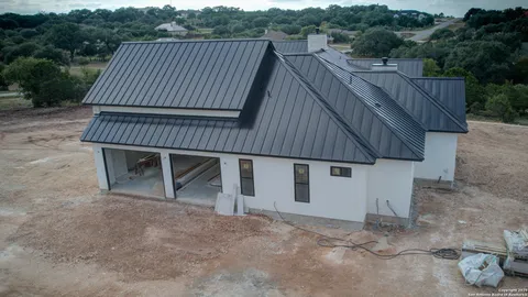 aerial view of a house with a roof deck