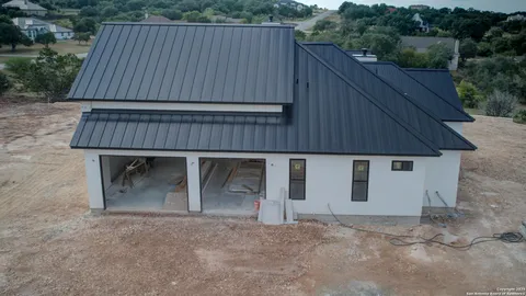 a backyard of a house with wooden fence