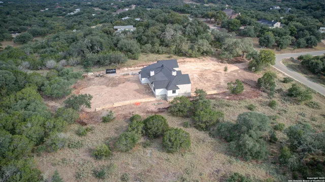 a view of a yard with a tree
