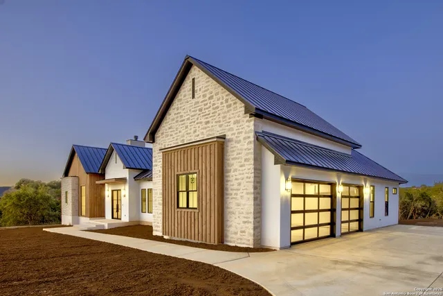 a view of a house with large windows