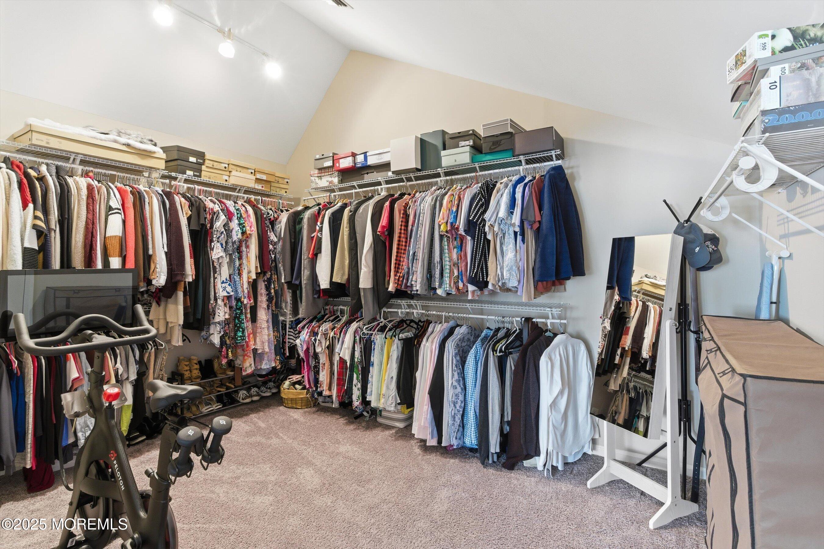 122 Quartz Lane Paterson, NJ 07501 - Photo 12 of 34 a view of walk in closet with clothes and shoes