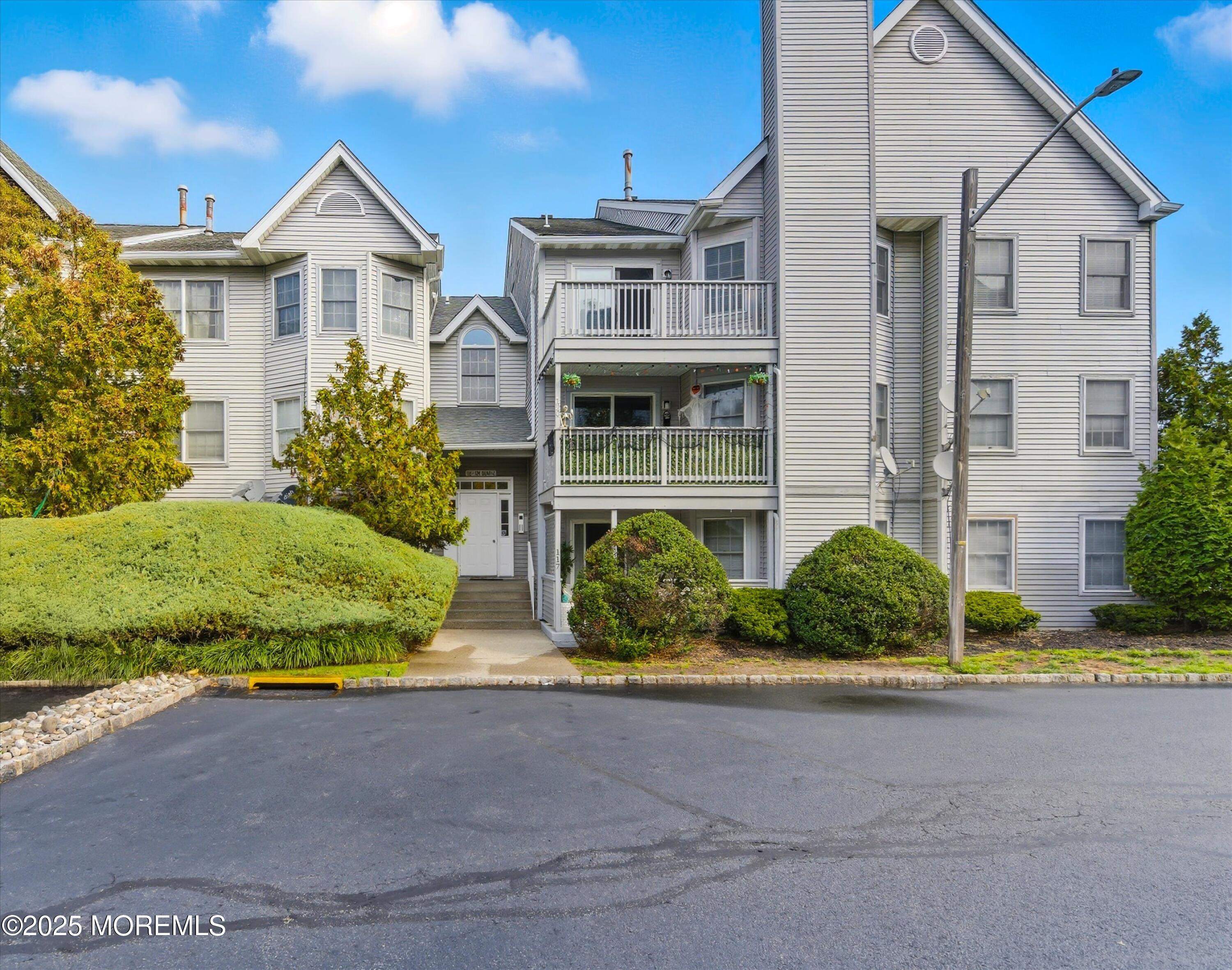 122 Quartz Lane Paterson, NJ 07501 - Photo 2 of 34 a front view of a house with a yard and outdoor seating