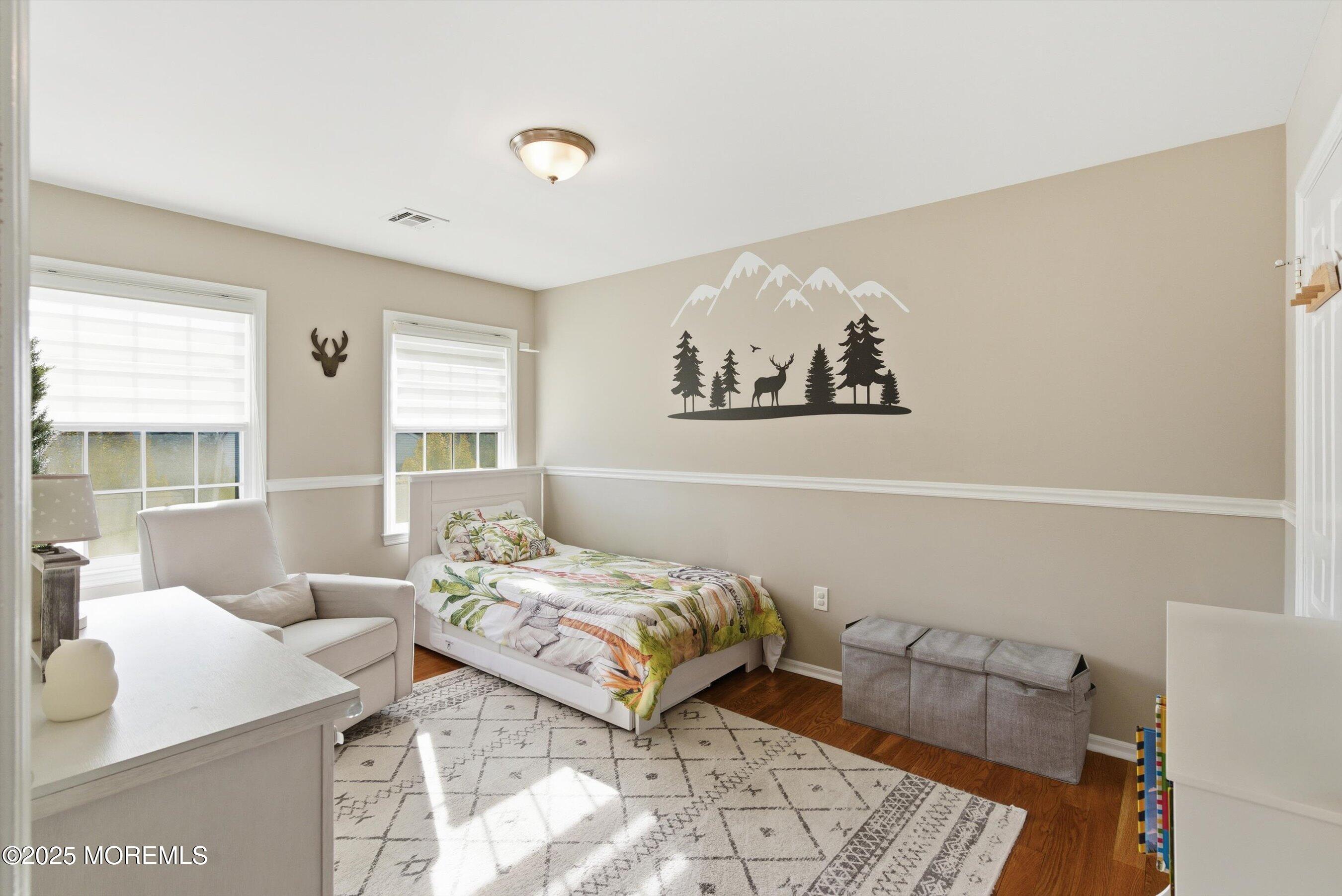 122 Quartz Lane Paterson, NJ 07501 - Photo 31 of 34 a bedroom with a bed and a couch