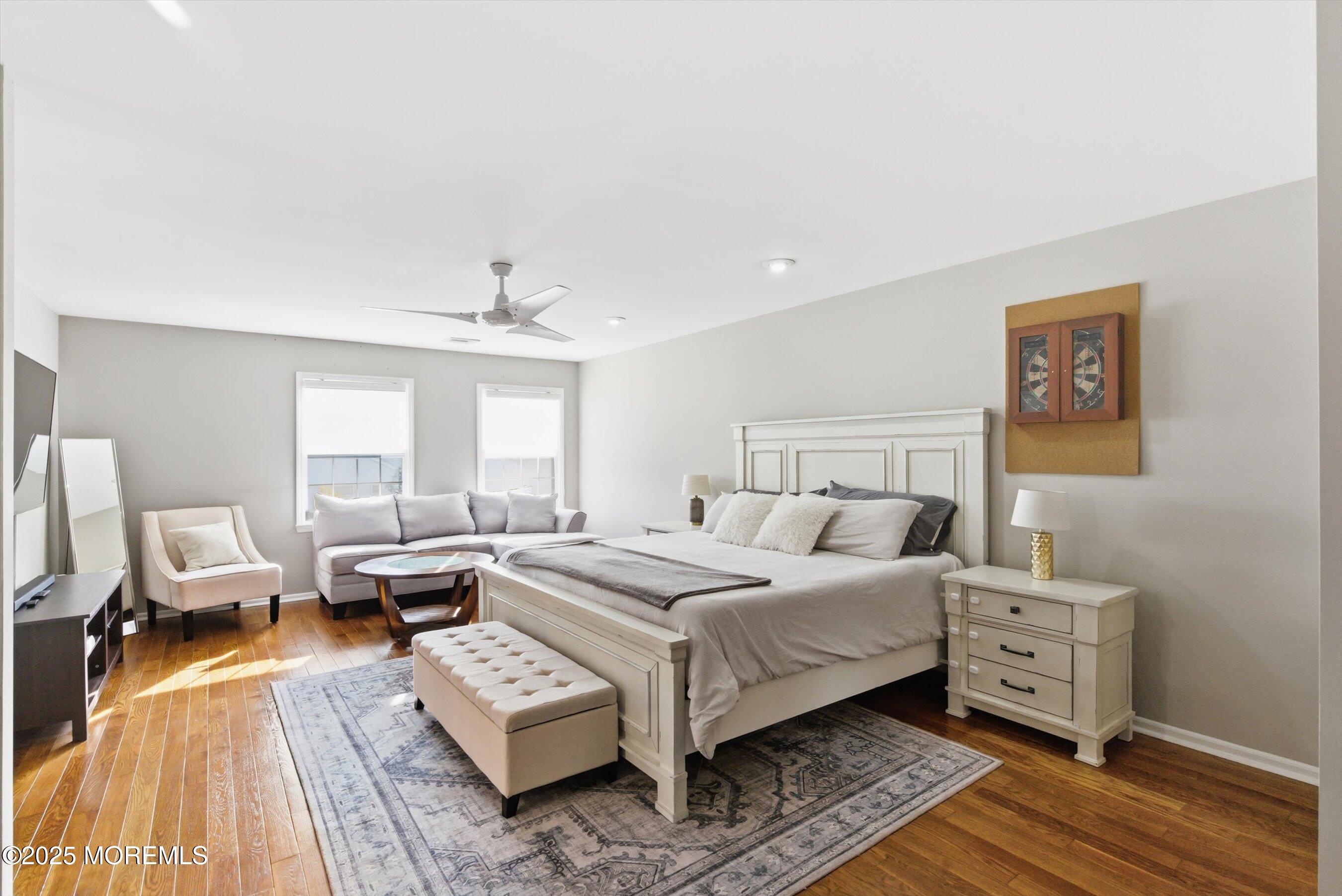 122 Quartz Lane Paterson, NJ 07501 - Photo 8 of 34 a bed room with a bed and a couch