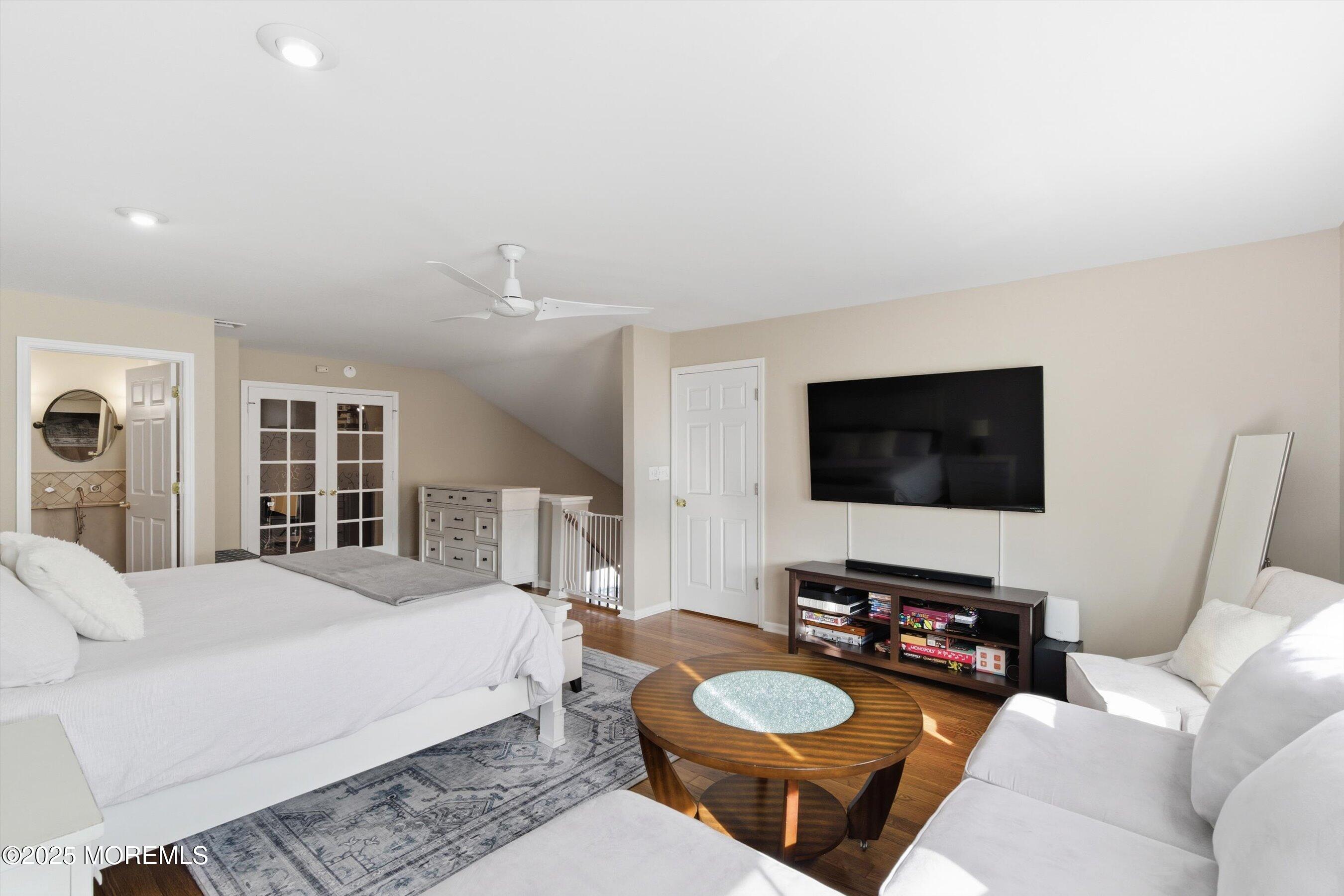 122 Quartz Lane Paterson, NJ 07501 - Photo 10 of 34 a living room with furniture a flat screen tv and a couch