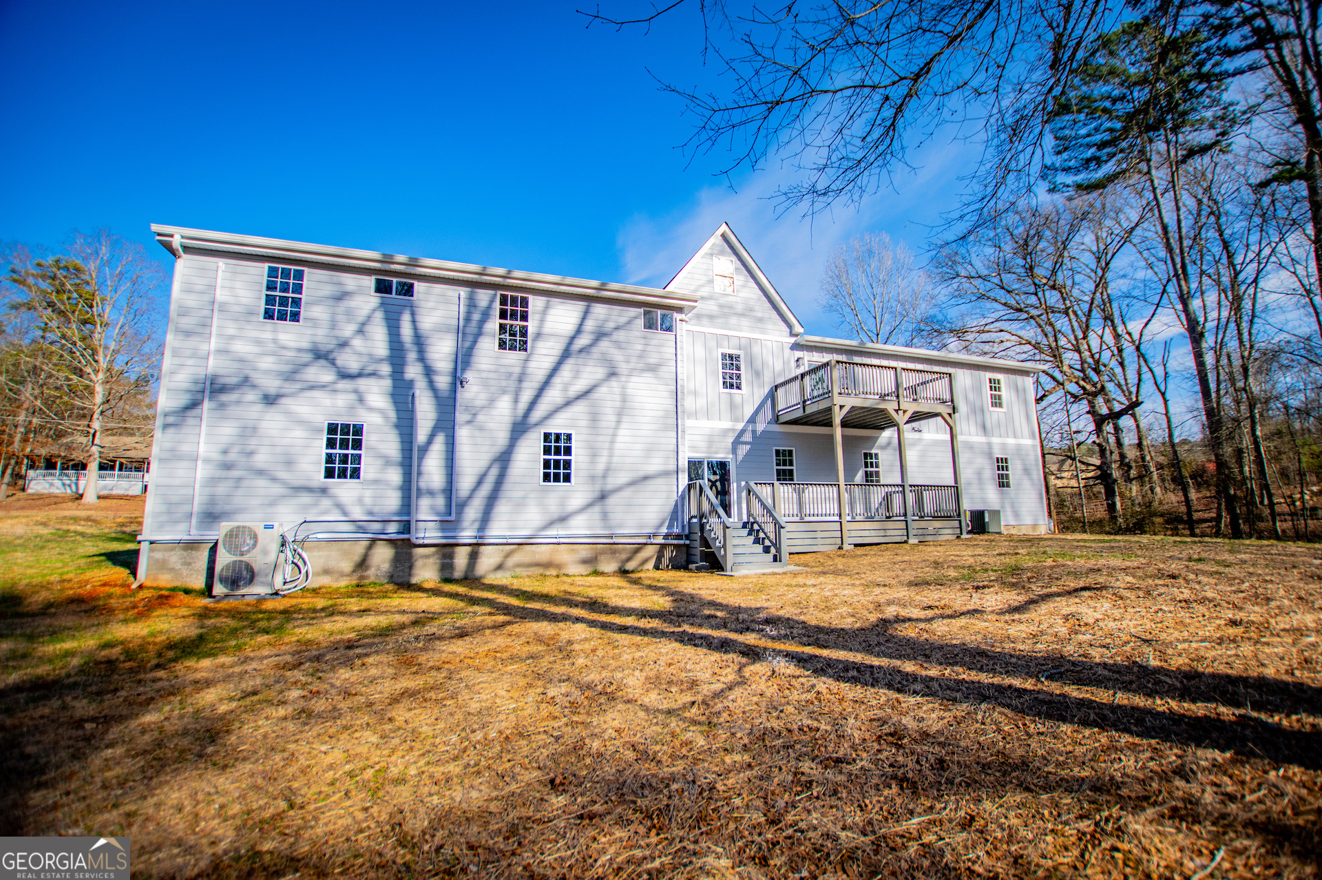 74 Jiles Road Carrollton, GA 30117 - Photo 105 of 130 a house with trees in front of it