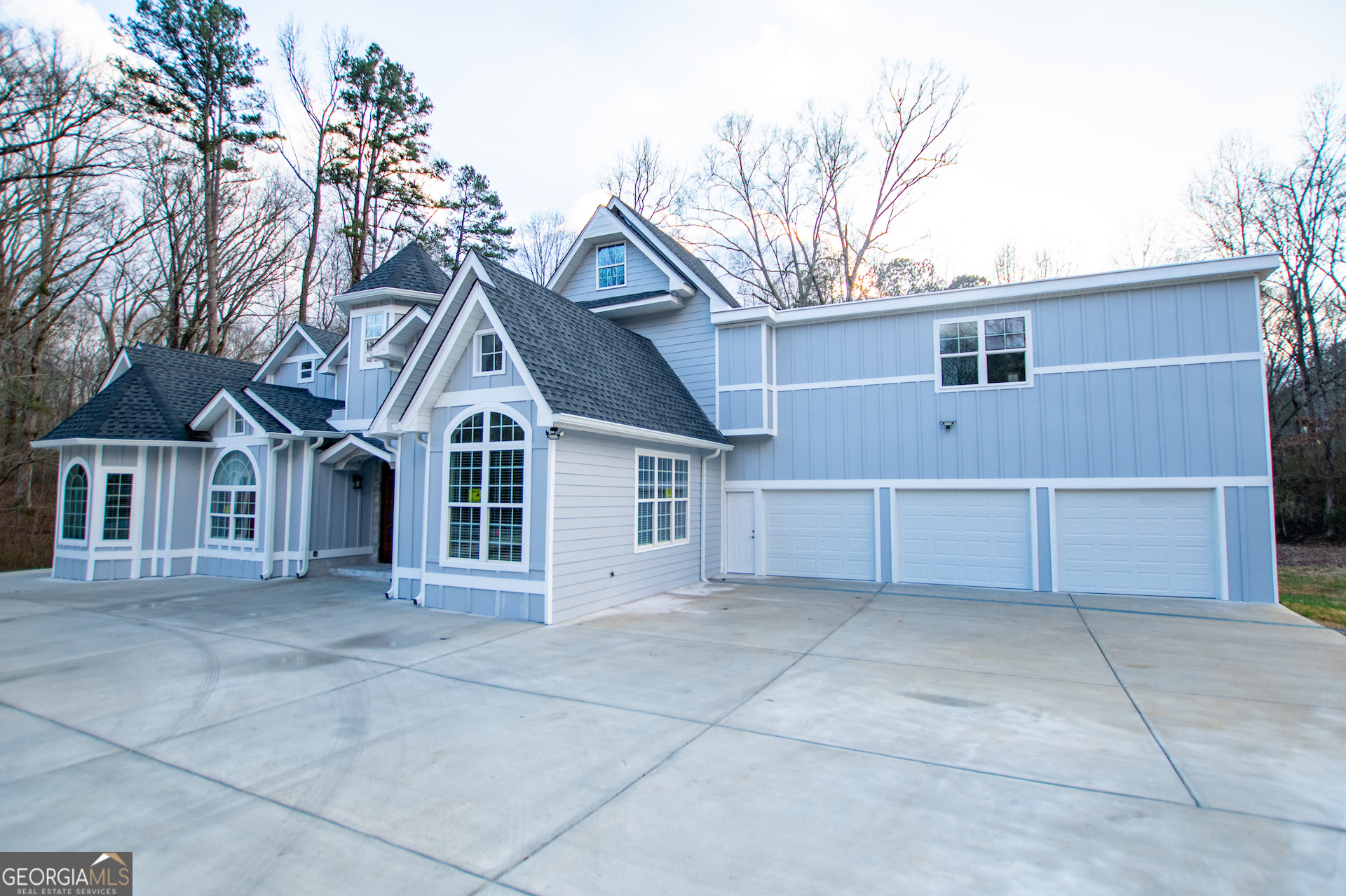 74 Jiles Road Carrollton, GA 30117 - Photo 114 of 130 a front view of a house with a garage and yard