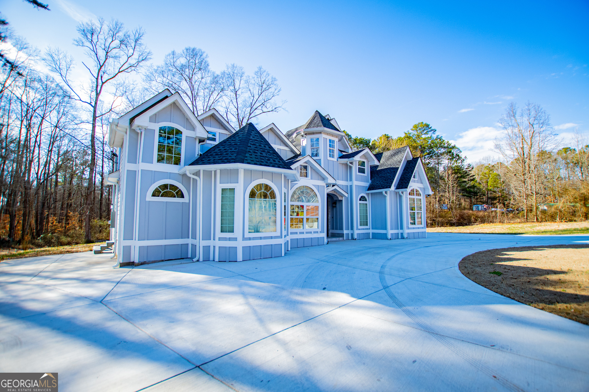 74 Jiles Road Carrollton, GA 30117 - Photo 119 of 130 a front view of a house with a yard garage and outdoor seating