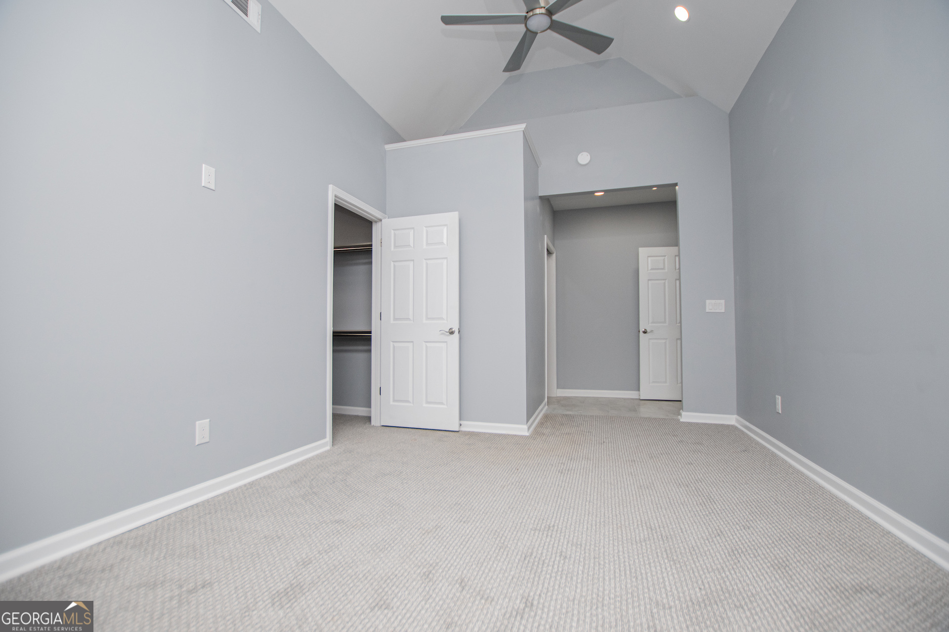 74 Jiles Road Carrollton, GA 30117 - Photo 36 of 130 an empty room with a ceiling fan and carpet