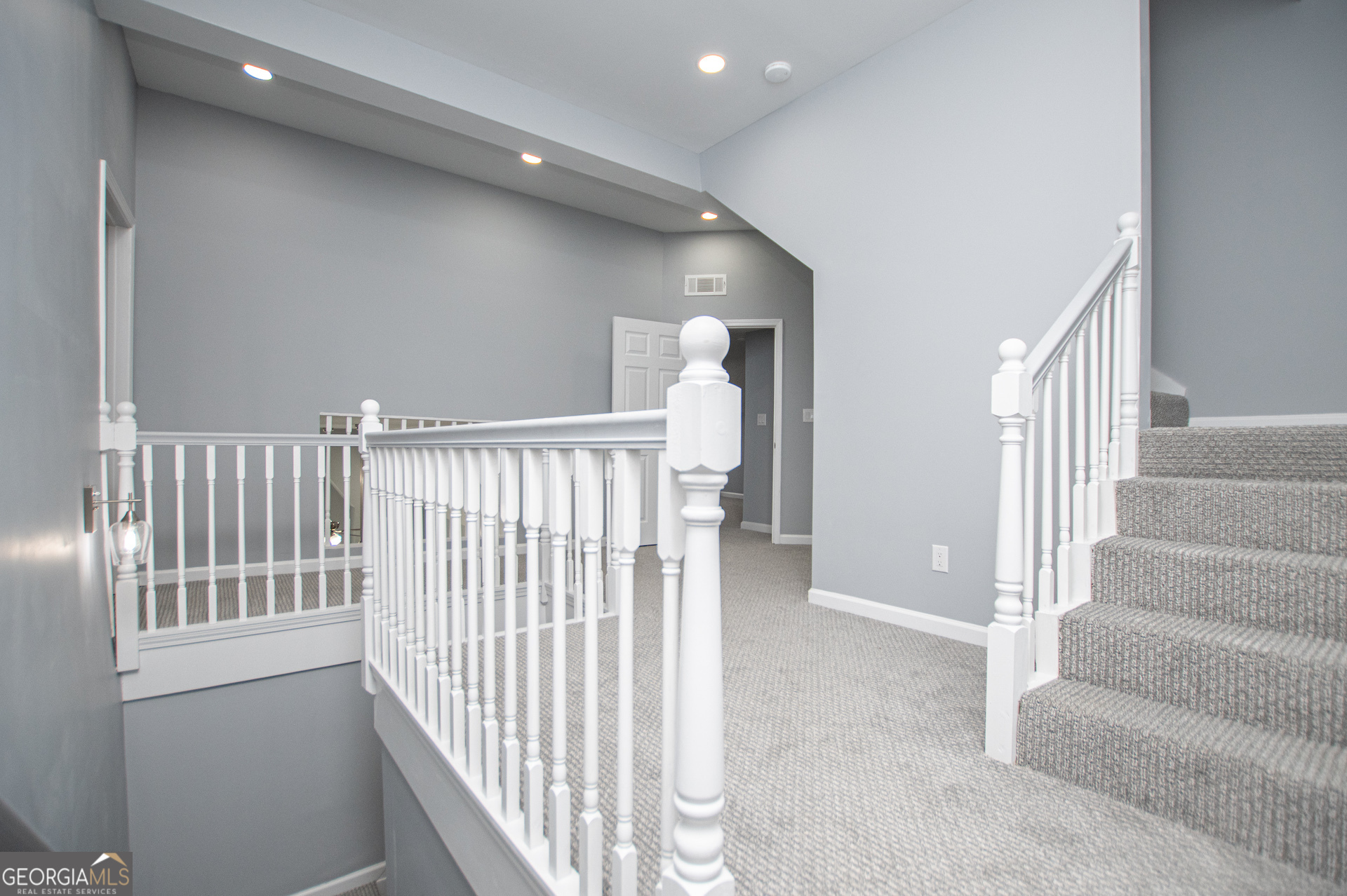 74 Jiles Road Carrollton, GA 30117 - Photo 48 of 130 a view of staircase with white walls and windows