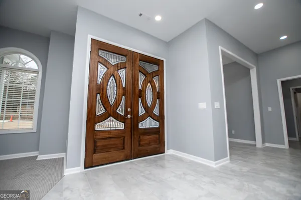 a view of an empty room with a window