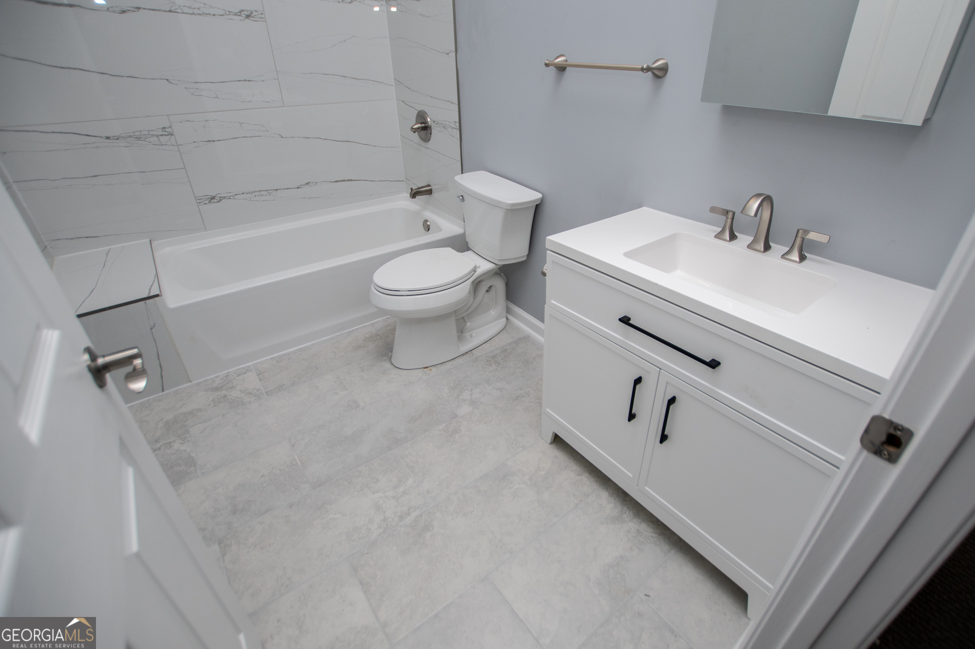 74 Jiles Road Carrollton, GA 30117 - Photo 71 of 130 a bathroom with a sink a toilet and bathtub