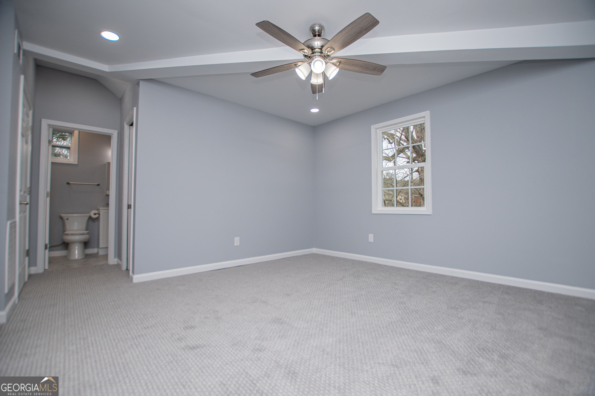 74 Jiles Road Carrollton, GA 30117 - Photo 74 of 130 an empty room with a window and a fan